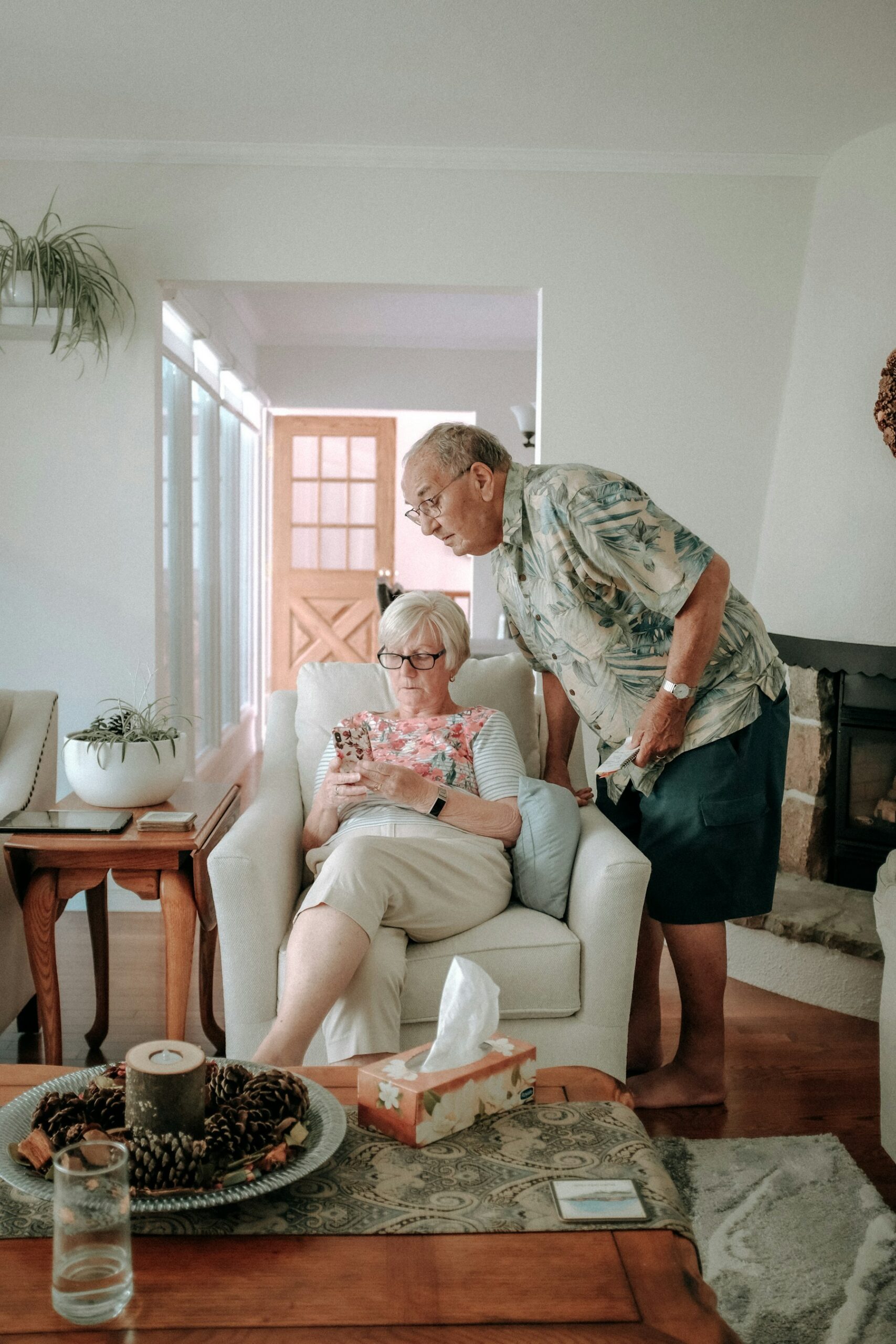 Older couple looking at a phone together at home